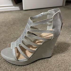 Silver wedge heels. Heel height 4 inches. Never used